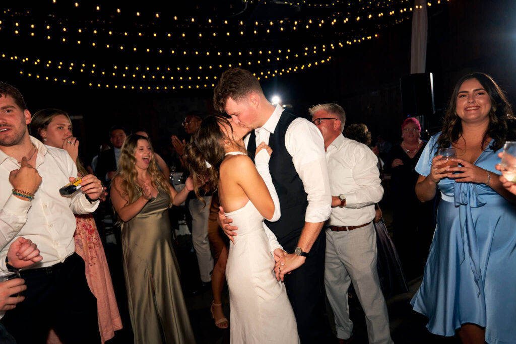 Couple kiss on the dance floor at Mount Hope Farm barn wedding.