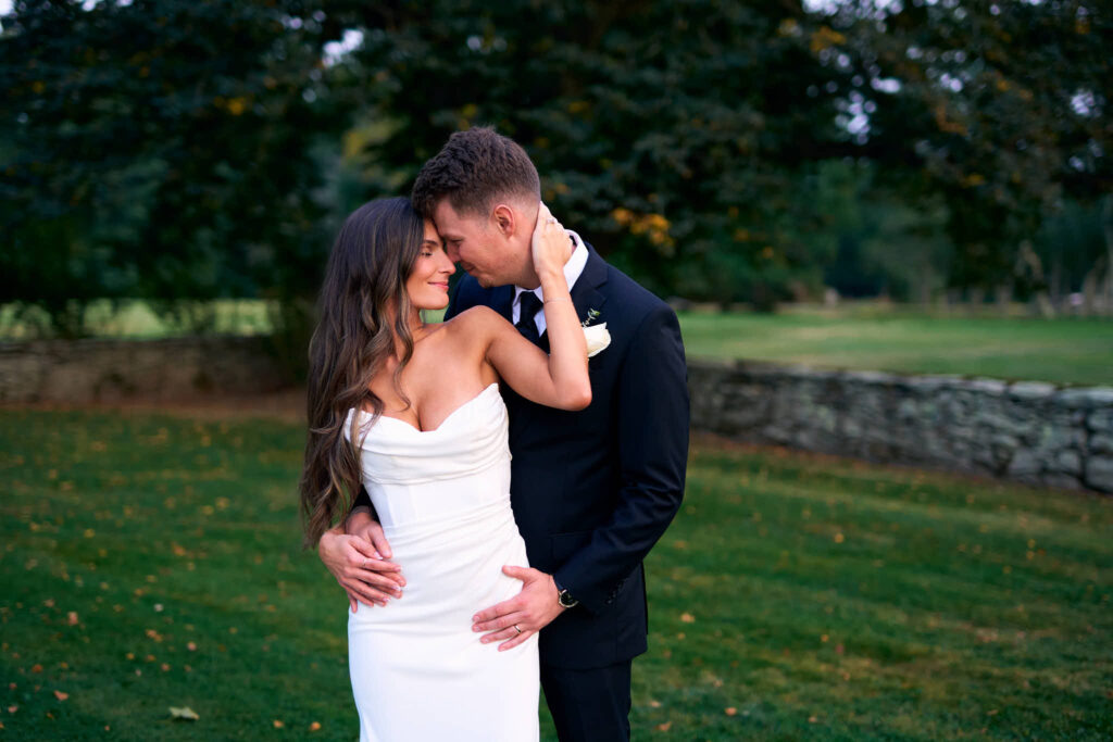 Bride and groom embrace at Mount Hope Farm in Bristol, Rhode Island