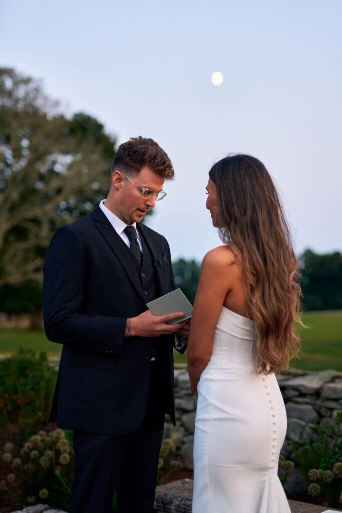 Couple read vows together under a full moon at Mount Hope Farm.