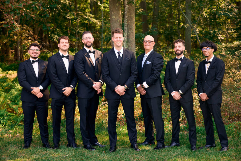 Groomsmen pose together at Mount Hope Farm wedding.