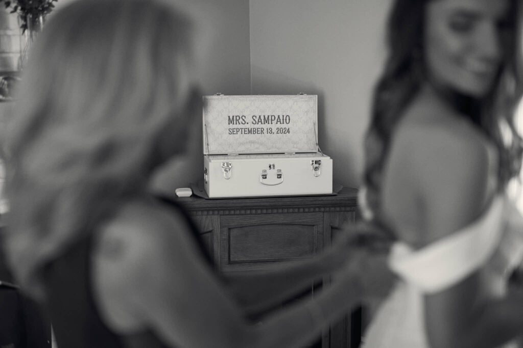 Documentary black and white image of a bride getting ready