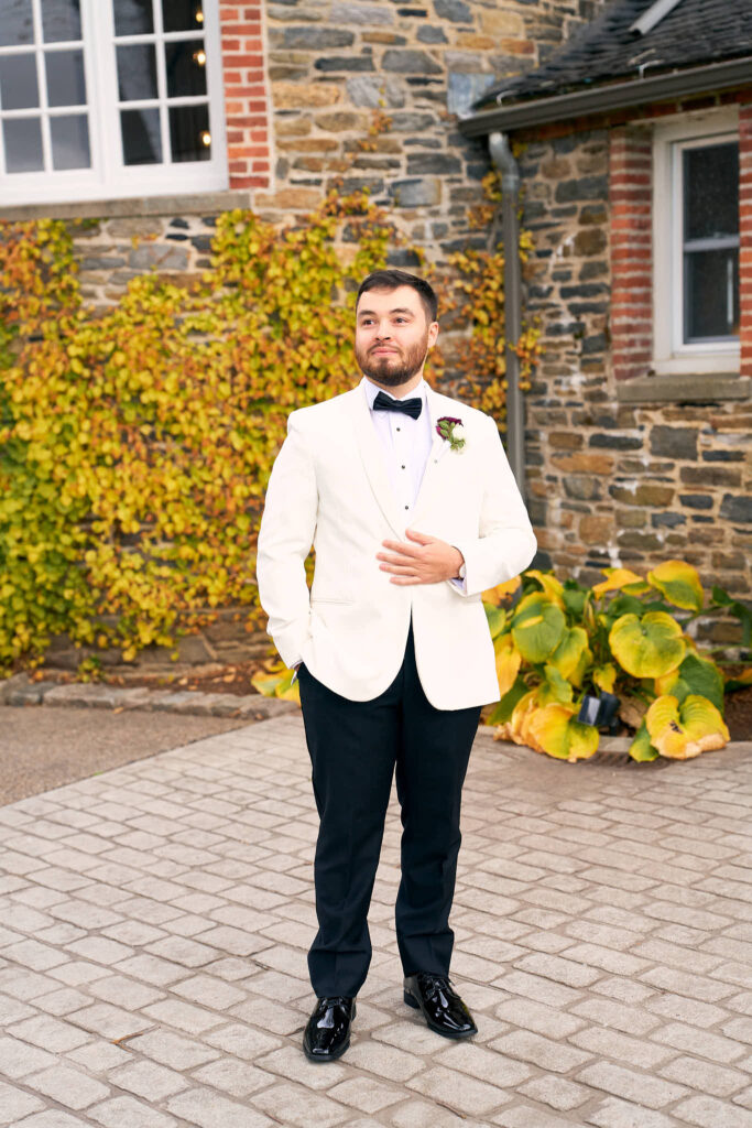 Groom standing outside the Shepherd's Run wedding venue