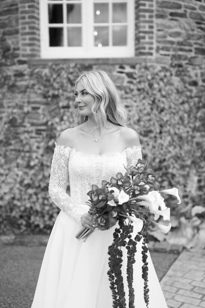 Bride holding a cascading bouquet at Rhode Island wedding