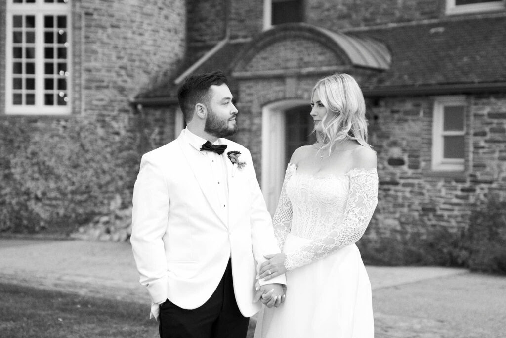 Bride and groom holding hands at their wedding in Rhode Island at Shepherd's Run