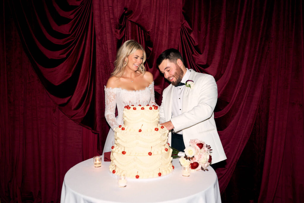Bride and groom cut their cake, photographed by Rhode Island wedding photographer