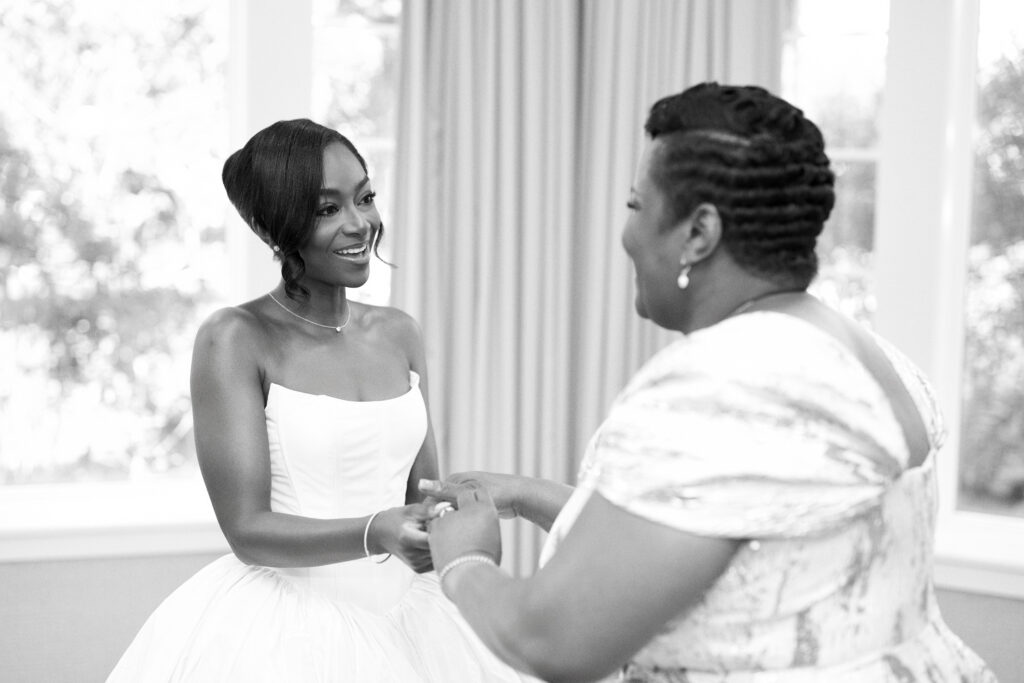 Mother and daughter first look, captured by a Connecticut wedding photographer