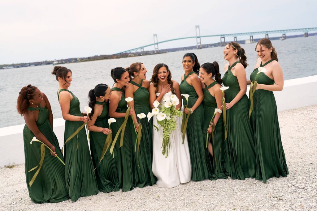 Bridal party portrait in front of the ocean at Belle Mer wedding