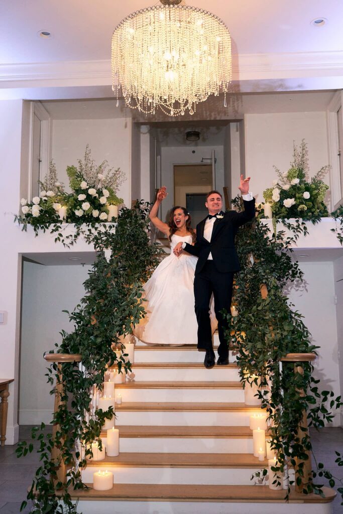 Bride and groom enter Belle Mer wedding reception